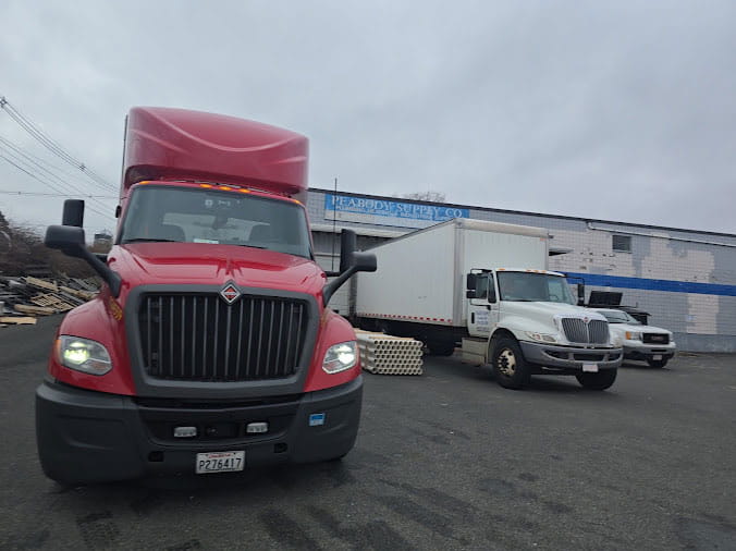 Large trucks unloading at Peabody Supply Company Peabody MA